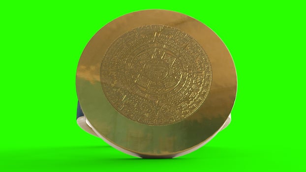 gold calendar ring with green background photo