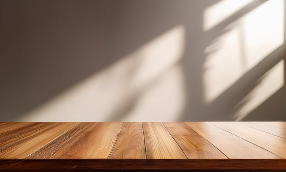Wooden table with shadow on wall photo