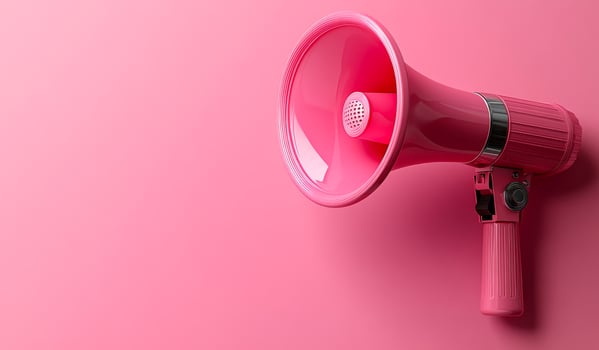 A pink microphone is on a pink background. The pink color of the microphone and the background creates a cheerful and vibrant mood. Concept of expressing oneself through music or public speaking photo