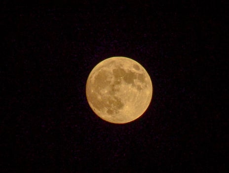 Golden Full Moon in a Starry Night Sky photo