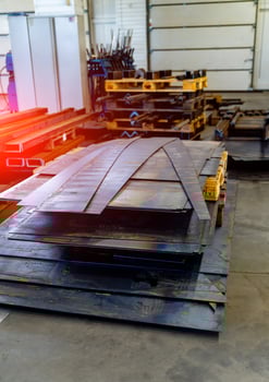 Metal manufacturing sheets on factory. Workshop industrial steel production. photo