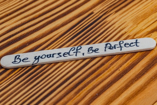 Be yourself be perfect, positive thoughts for self esteem on wooden sticks photo