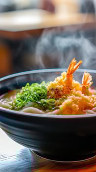 Japanese udon noodle soup with shrimps on table photo