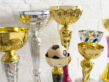 Win on sports betting, online bookmaker service. Football soccer ball, golden trophy cup, Banner design photo