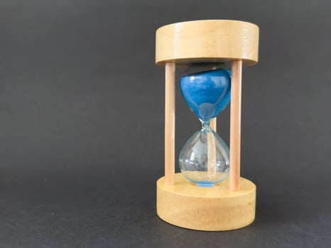 Modern hourglass background. Hourglass time concept for business deadline, urgency and outcome of time photo