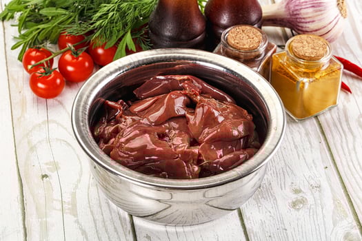 Raw chicken liver uncooked in the bowl photo