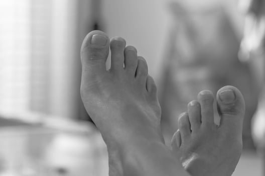 Artistic Black and White Photo of Bare Feet in Minimalist Style