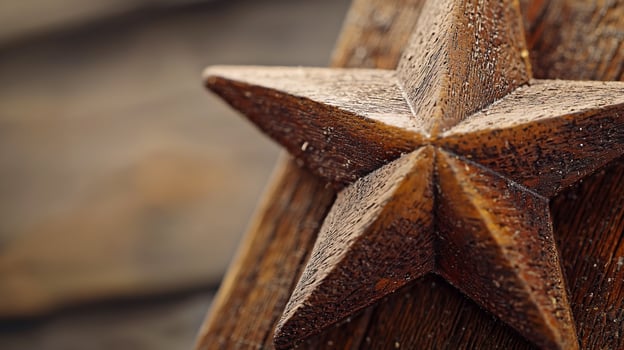 A close up of a wooden star on a wooden surface photo