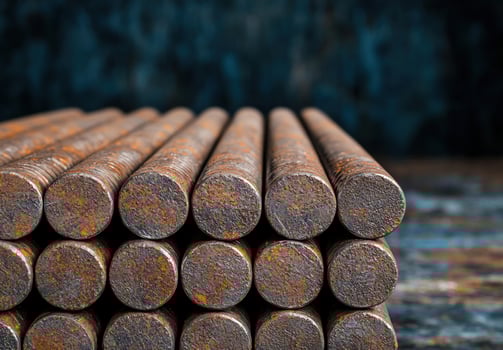 Stacked rusty metal pipes photo