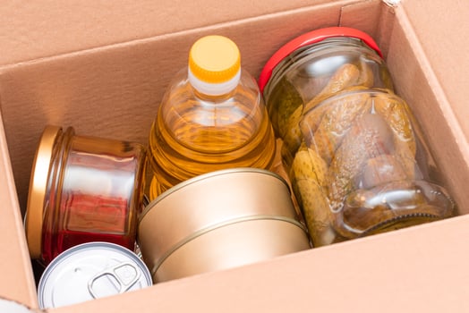 Food Reserves or Donation Box. Carton Box with Canned Food, Cereals and Grocery. Emergency Food Storage in Case of Crisis. Free Social Help, Blessings and Care. Strategic Food Supplies photo