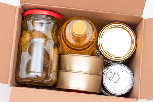 Food Reserves or Donation Box. Carton Box with Canned Food, Cereals and Grocery. Emergency Food Storage in Case of Crisis. Free Social Help, Blessings and Care. Strategic Food Supplies photo