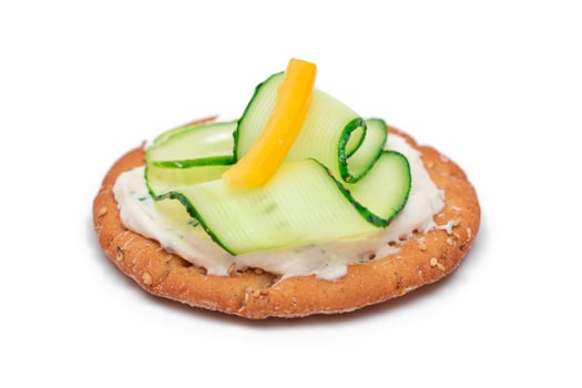 Crispy Cracker Sandwich with Fresh Cucumber, Yellow Paprika and Cottage Cheese - Isolated on White. Easy Breakfast. Quick and Healthy Sandwiches. Crispbread with Tasty Filling. Healthy Dietary Snack photo
