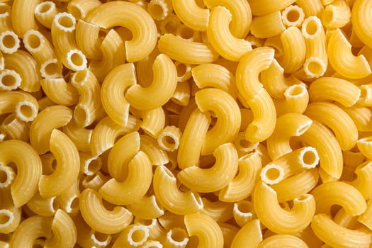 Uncooked Chifferi Rigati Pasta. A Culinary Canvas of Chifferi Rigati, Creating a Lively and Textured Background for Gourmet Cooking. Dry Pasta. Raw Macaroni - Top View, Flat Lay photo