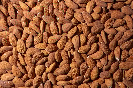 Scattered Almonds. Background from Almond Nuts. Natural High-Calorie Snacks photo