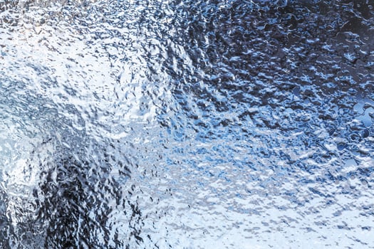 Frozen ice pattern on glass photo