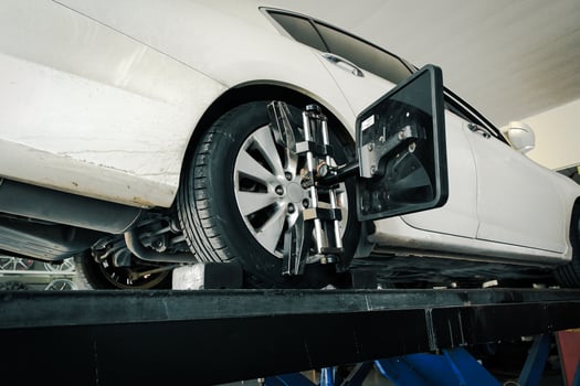 Vehicle wheel alignment with standard wheel alignment machine in auto repair shop , Car maintenance concept photo