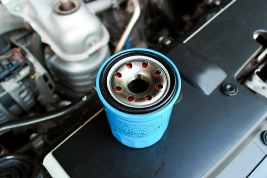 Automotive oil filter on engine bay , Car maintenance concept photo