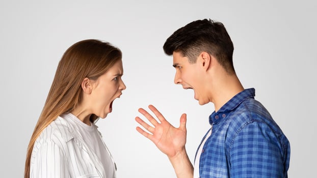 Boyfriend and girlfriend swears and screams, profile, free space photo