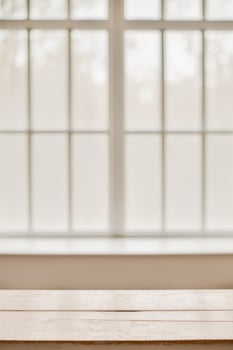 Empty wooden table in front of a window photo