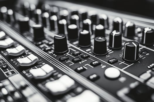 Close up view of audio mixing console with knobs and controls during music production session photo