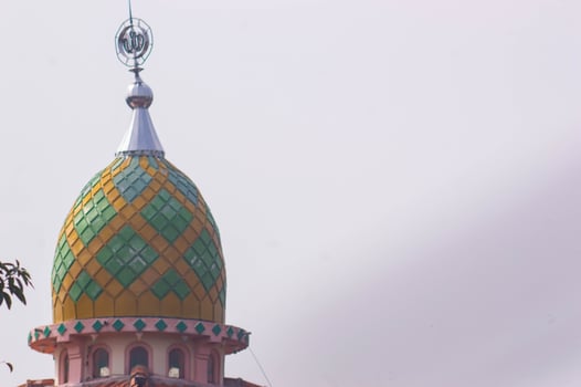 view of the mosque dome with a white sky background photo