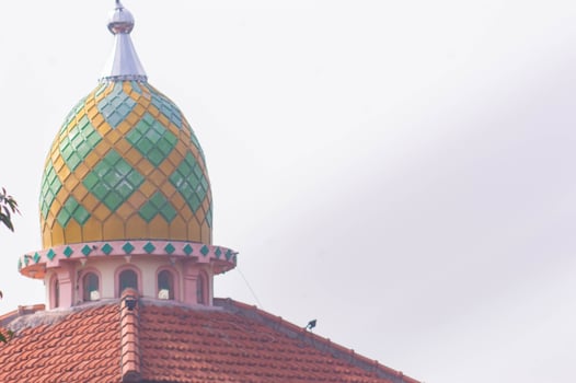view of the mosque dome with a checkered pattern and bright colors photo