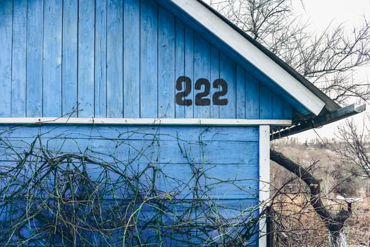 Old abandoned house made of wood with faded paint. photo