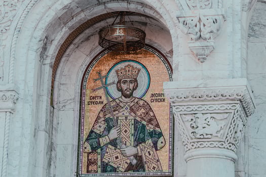 A mosaic of st george on the side of a building photo