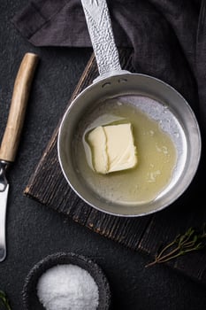 Melted butter on in iron pan photo