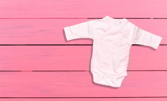 Children's clothing on wooden boards photo