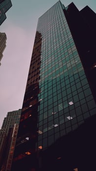 Looking Up at a Tall Building With Many Windows photo