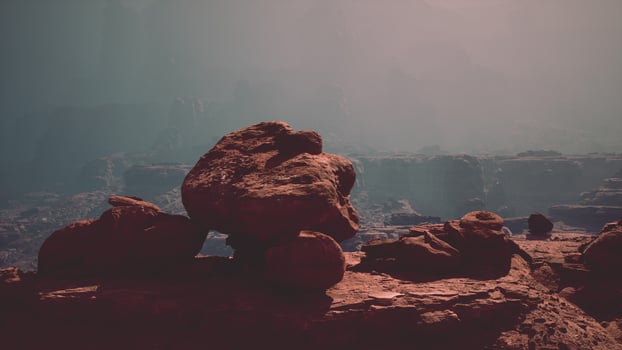 Large Rock Resting on Rocky Hillside photo