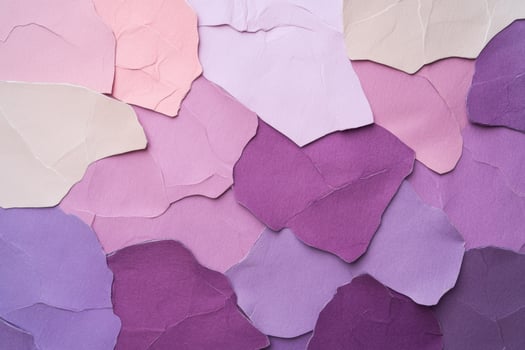 Close-up view of textured paper pieces in shades of plum and wine red with soft lighting for a vintage feel photo