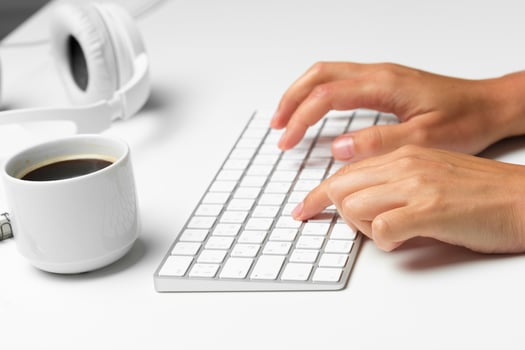 women's hands using keyboard and mouse photo