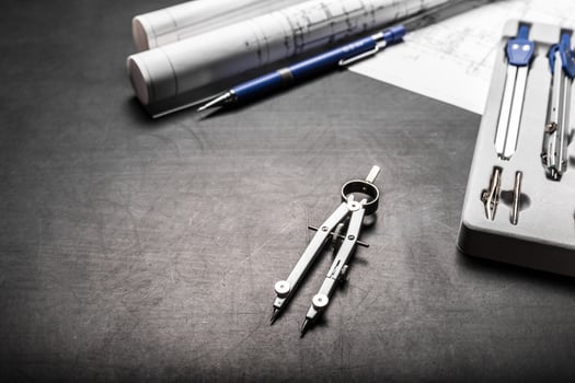 Construction planning drawings on black background photo