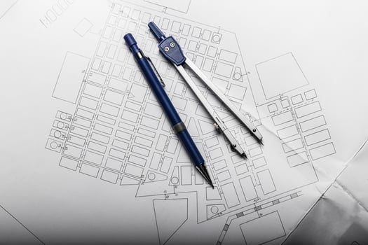 Construction planning drawings on black background photo