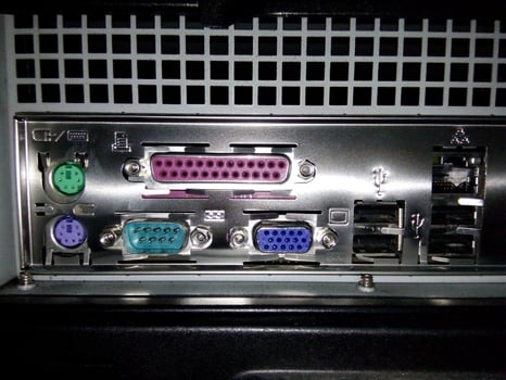 The back of a computer with several different types of connectors photo