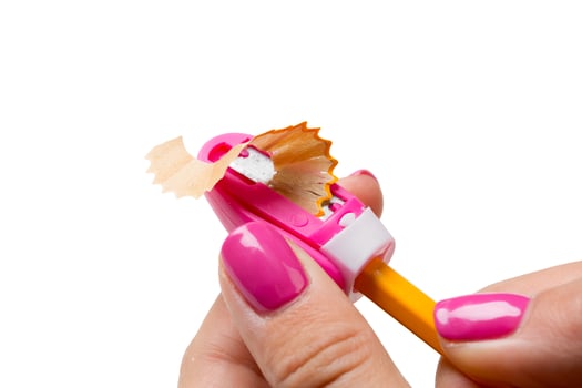 Woman is sharpening the pencil photo