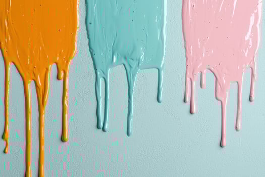 Colorful paint drips on a textured wall photo