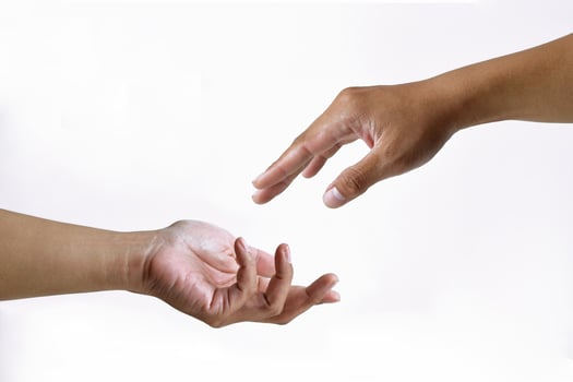 Pose of two people's hands giving and receiving something on a white background photo