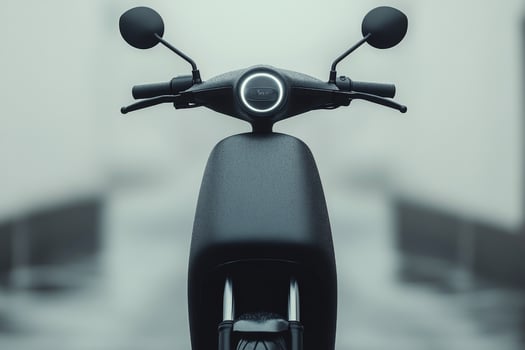 Modern black electric scooter showcased against a minimalist background in studio lighting photo