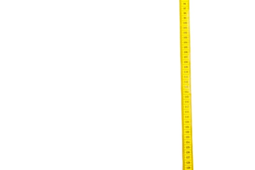 yellow metric measuring tape isolated on white panorama background photo