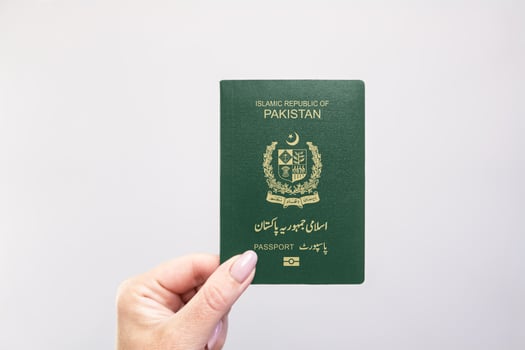 Passport Pakistan Held Against Simple White Background. Astana, Kazakhstan, 26 october 2024 photo