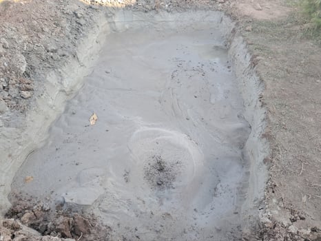 Construction team digging a fresh water well photo