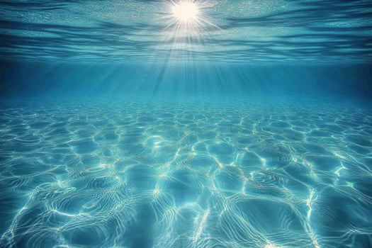 Serene turquoise ocean under bright sun reflects clouds and waves at midday by the coast photo