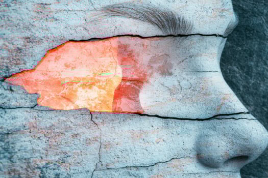 Cracked stone surface with vibrant orange texture photo
