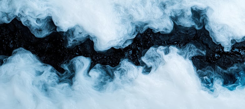 Swirling blue smoke on black background photo