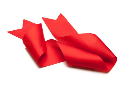 red ribbon isolated on white background photo