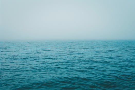 serene ocean horizon with calm waves photo