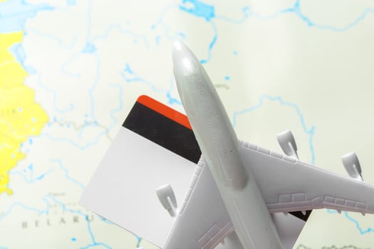 miniature of a passenger aircraft flying on a map photo